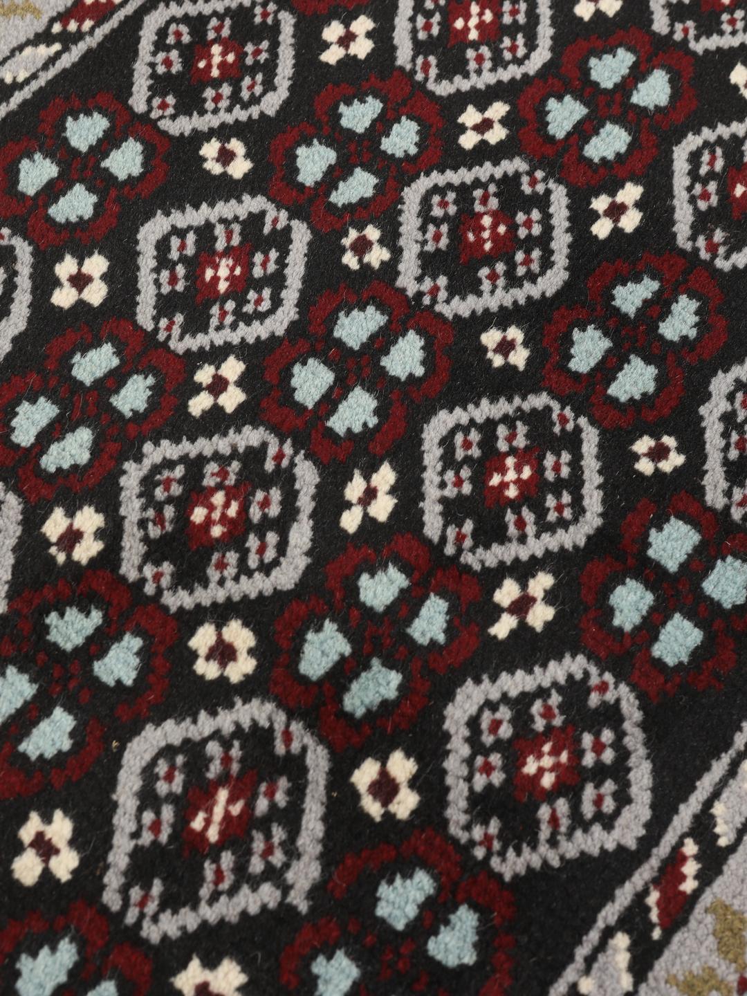 Hand-knotted Beluch rug with geometric patterns in multicolor from the Middle East