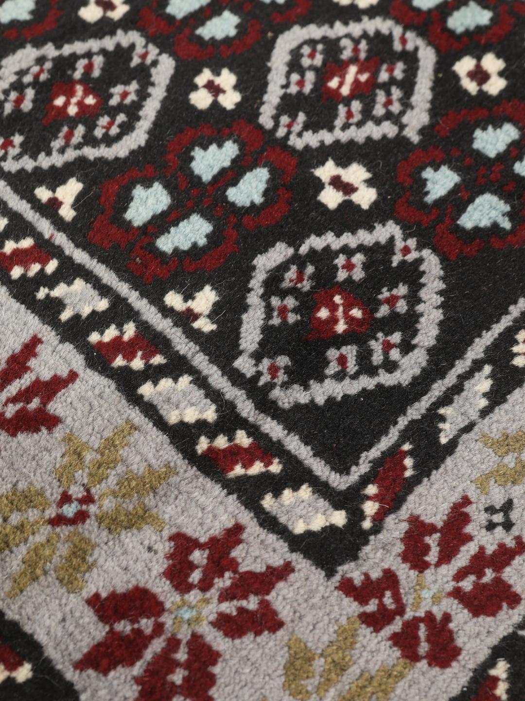 Hand-knotted Beluch rug with geometric patterns in multicolor from the Middle East