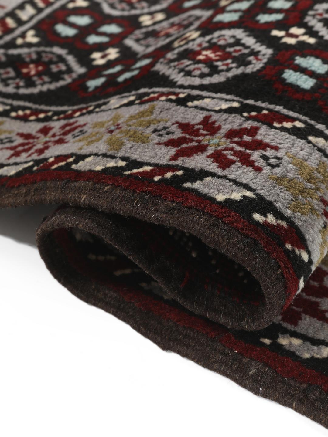 Hand-knotted Beluch rug with geometric patterns in multicolor from the Middle East