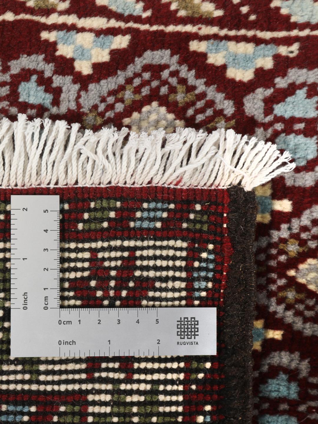Håndknyttet Baluch-tæppe med geometriske mønstre i mørkerød og beige