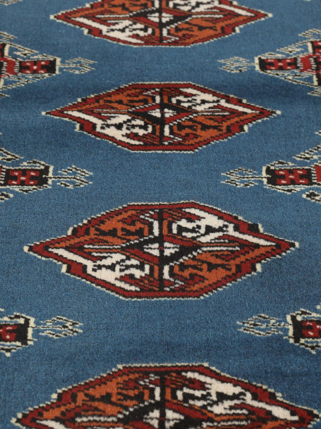 Hand knotted blue Turkaman rug from the Middle East