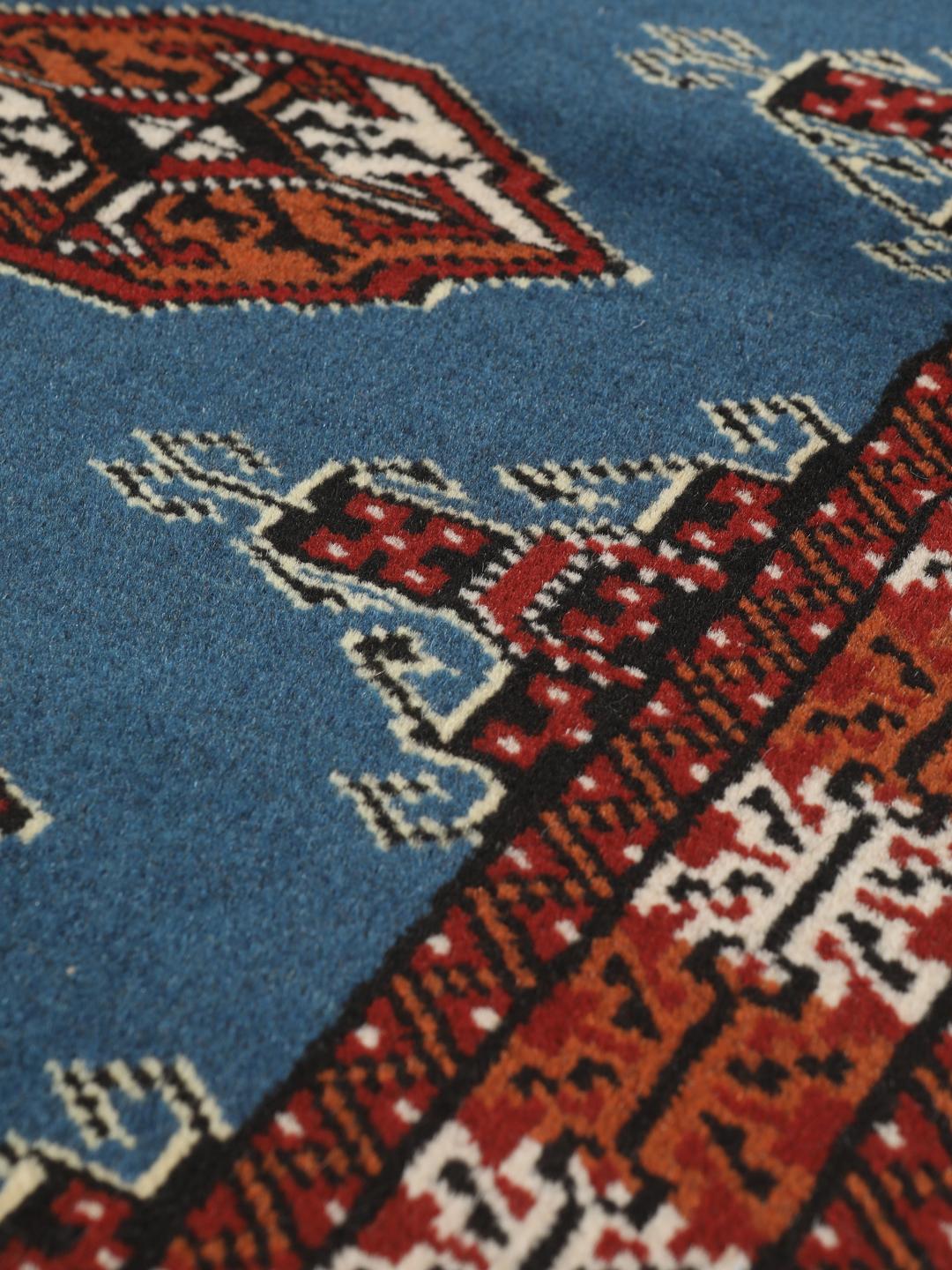 Hand knotted blue Turkaman rug from the Middle East