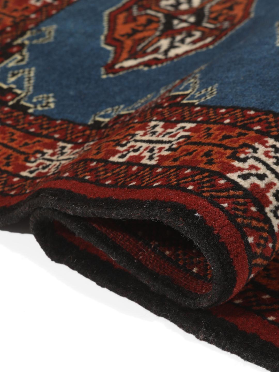 Hand knotted blue Turkaman rug from the Middle East