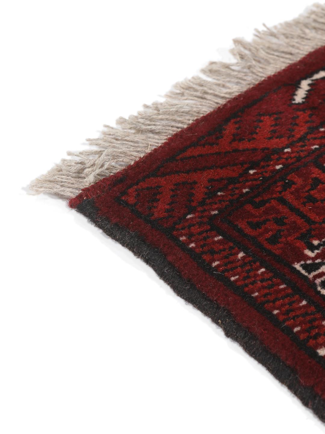 Hand-knotted Turkaman rug from the Middle East in dark-red and dark-teal