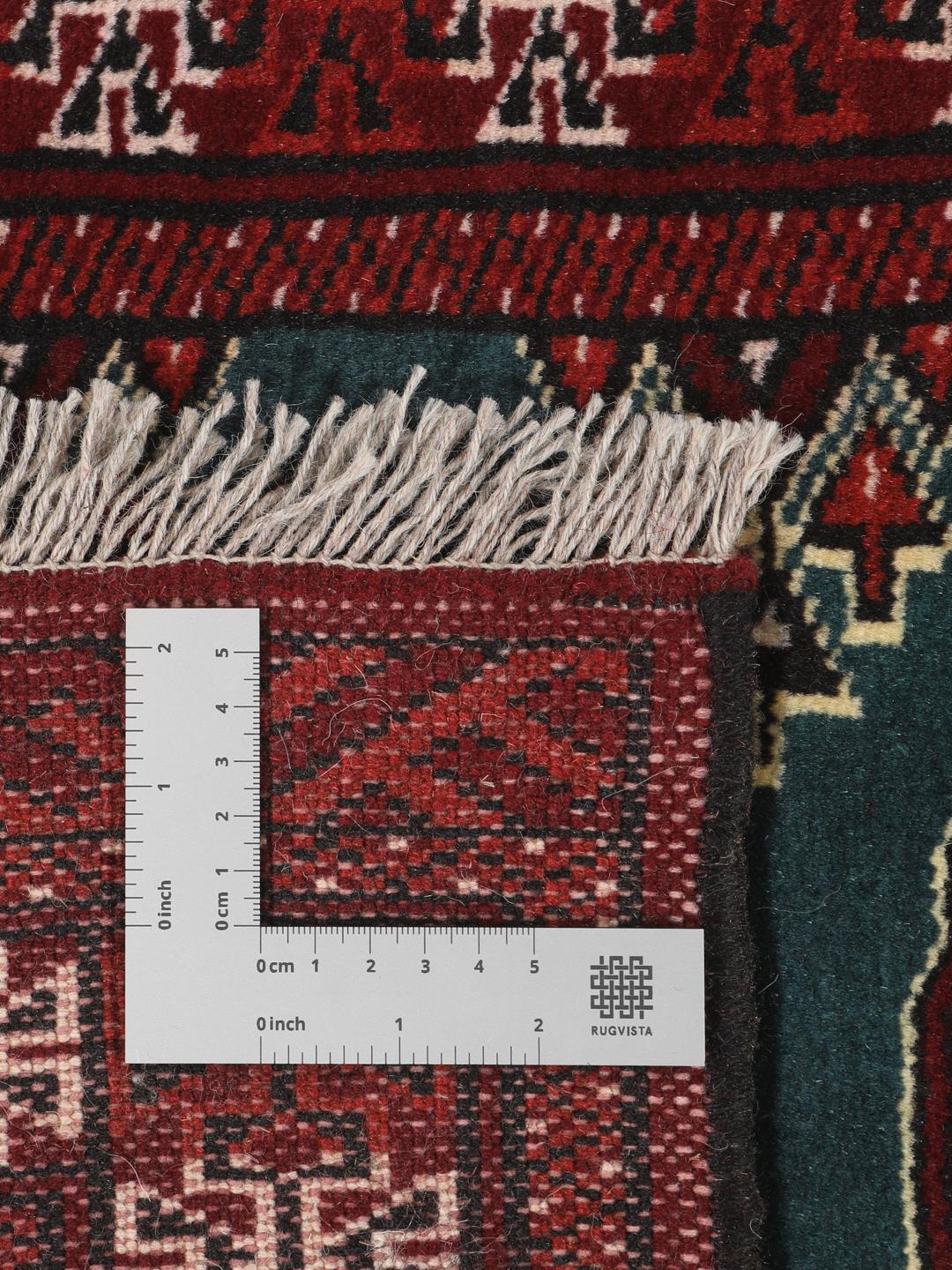 Hand-knotted Turkaman rug from the Middle East in dark-red and dark-teal