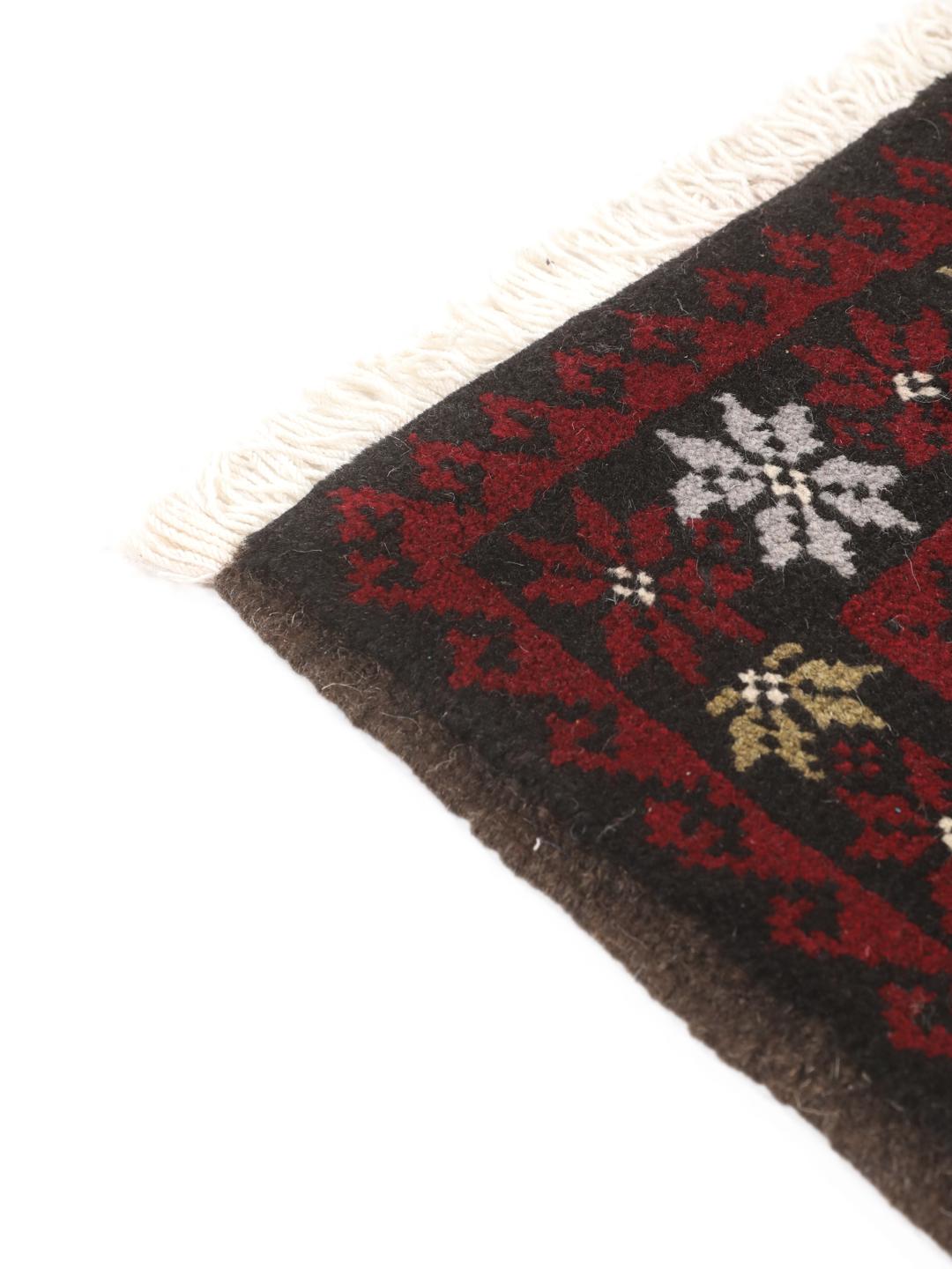 Hand-knotted Baluch rug with geometric patterns in dark-red and dark-grey