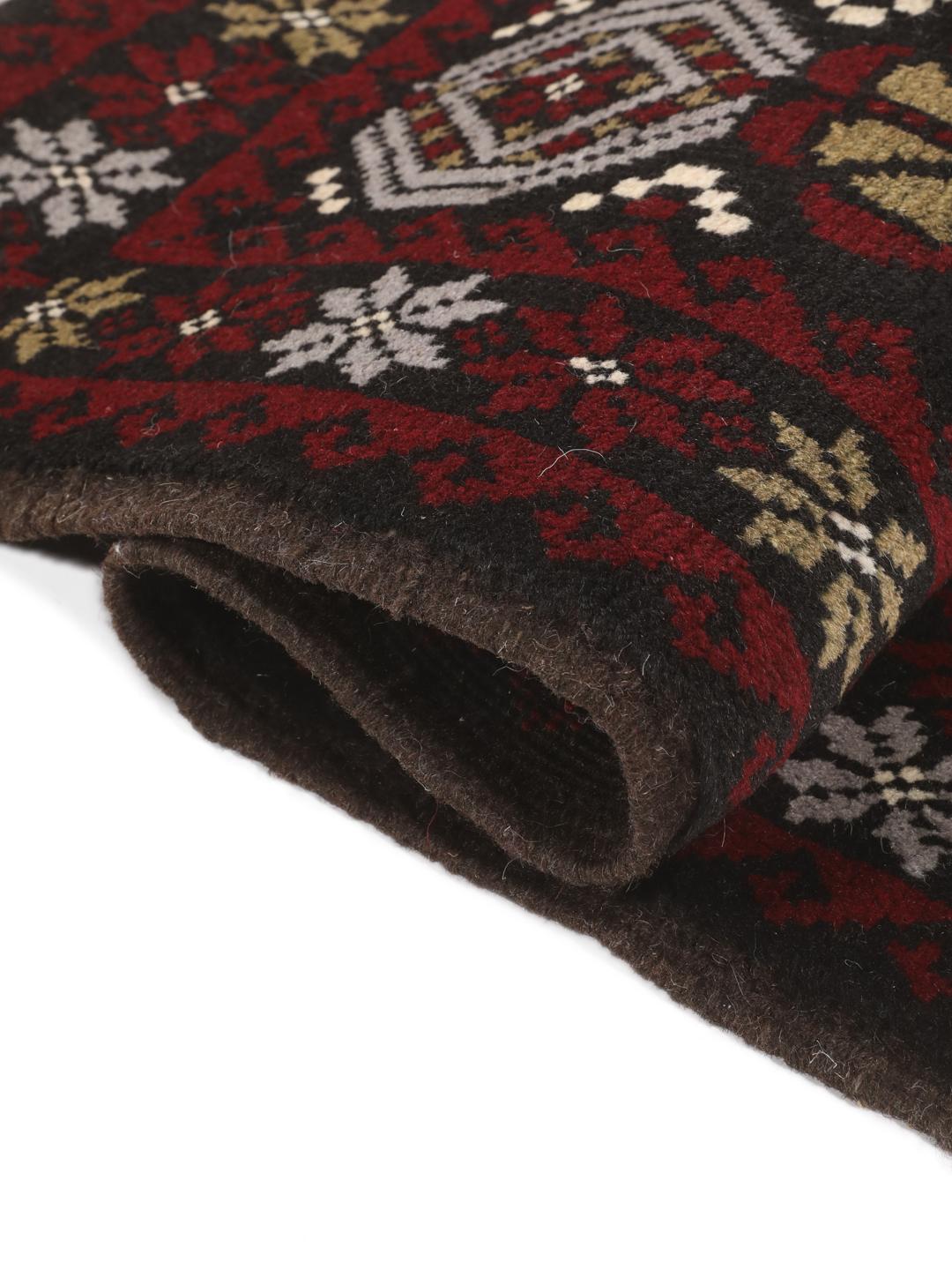 Hand-knotted Baluch rug with geometric patterns in dark-red and dark-grey