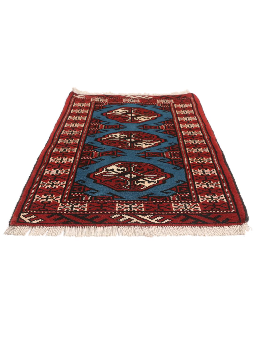 Hand-knotted Turkaman rug from the Middle East in red and blue tones