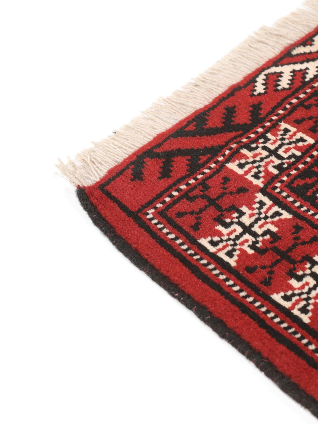 Hand-knotted Turkaman rug from the Middle East in red and blue tones