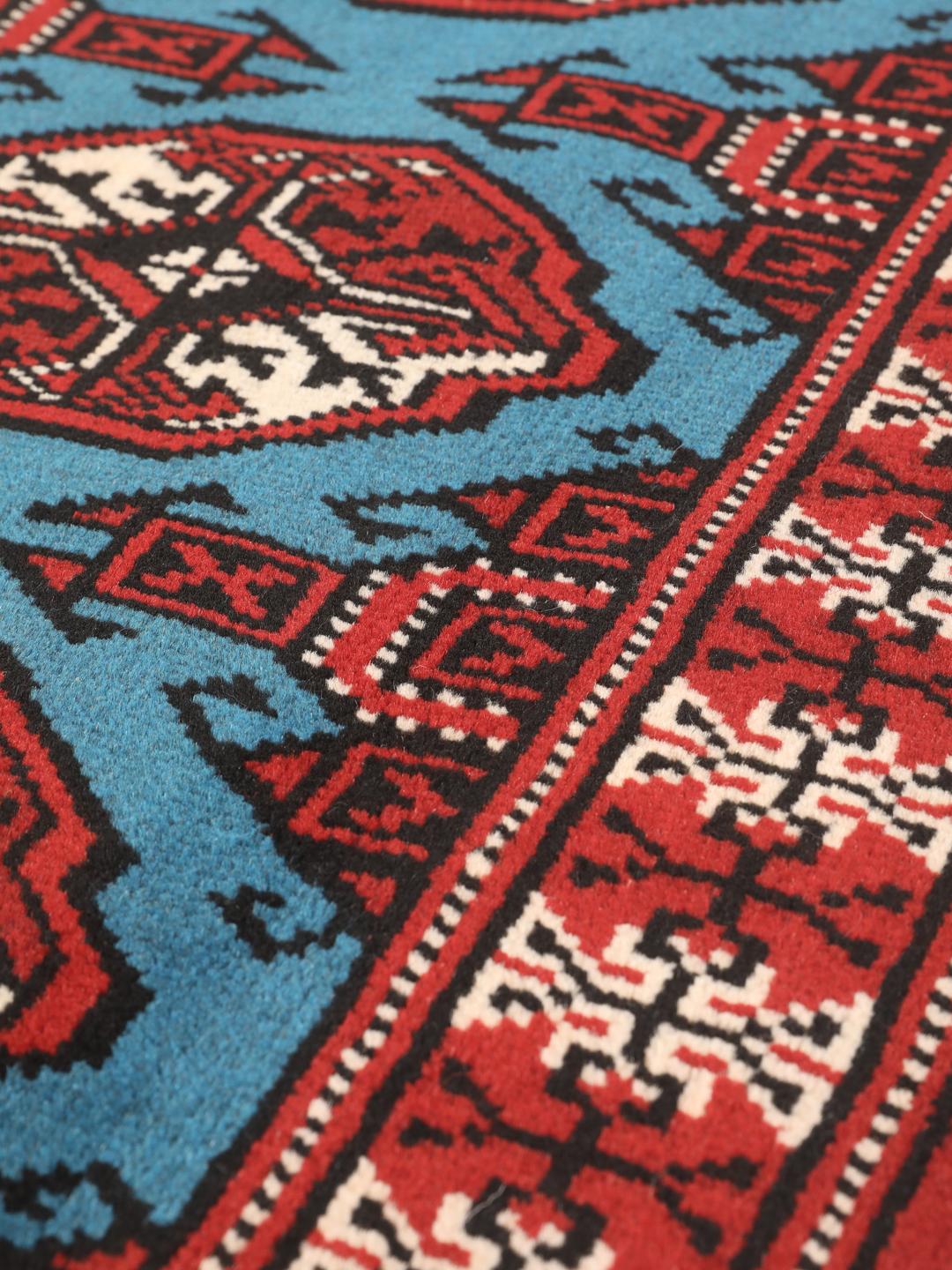 Hand-knotted Turkaman rug from the Middle East in red and blue tones