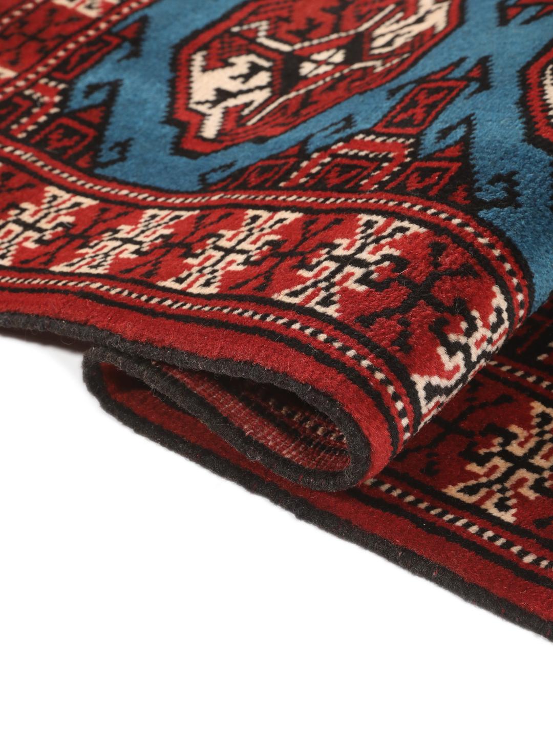 Hand-knotted Turkaman rug from the Middle East in red and blue tones