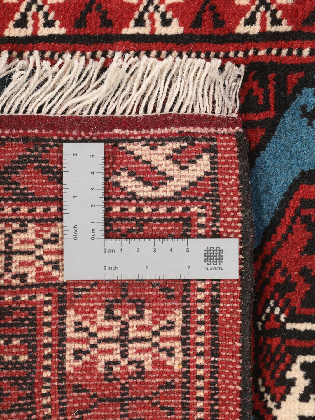 Hand-knotted Turkaman rug from the Middle East in red and blue tones