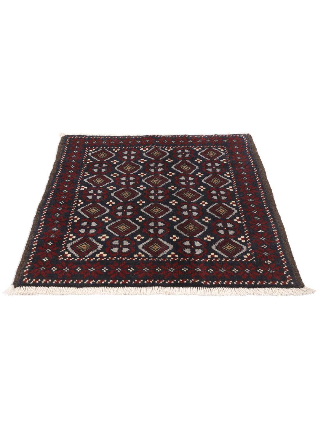 Hand-knotted Baluch rug with geometric motifs in dark-blue and red from the Middle East
