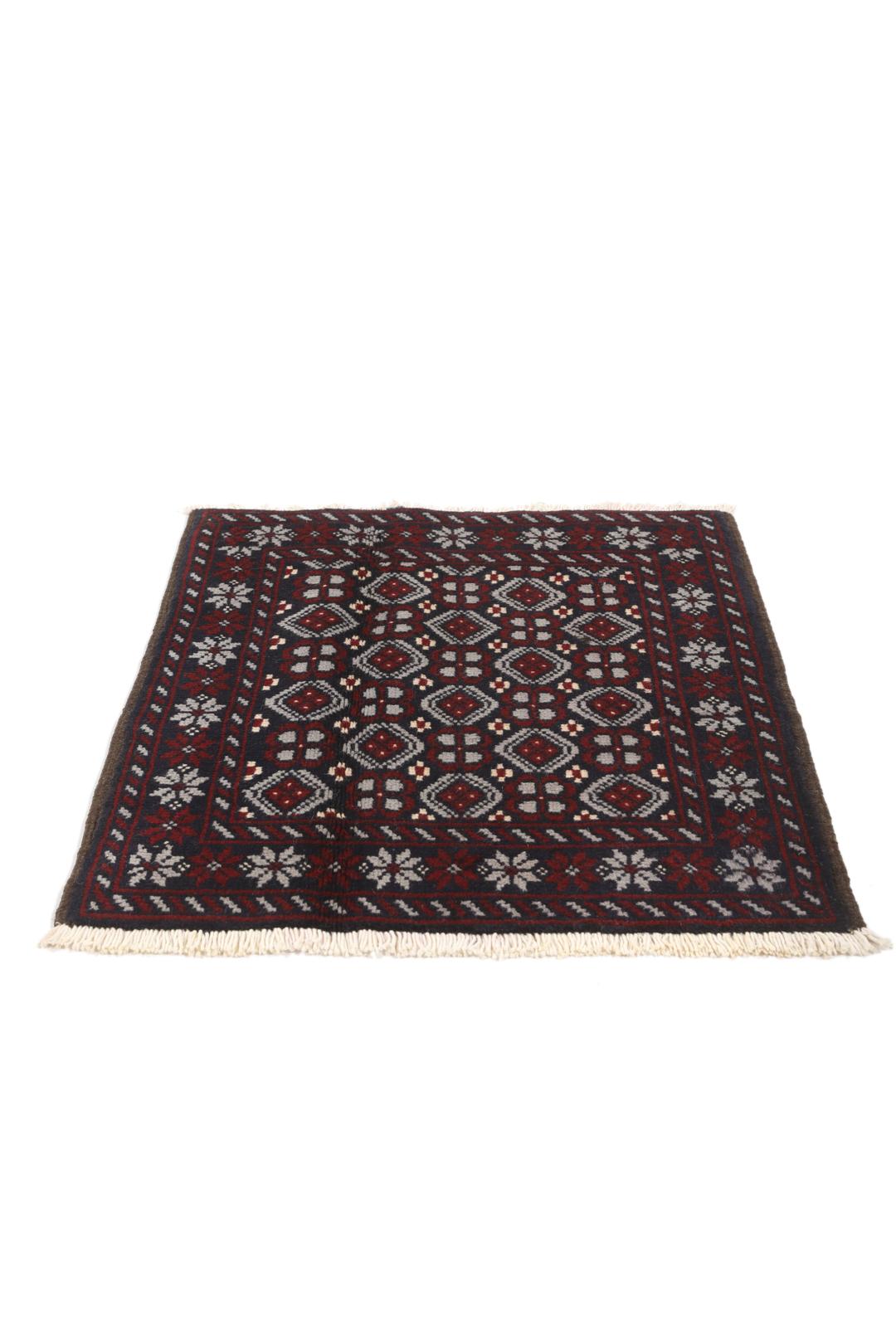 Hand-knotted Baluch rug with geometric tribal patterns in dark blue and red