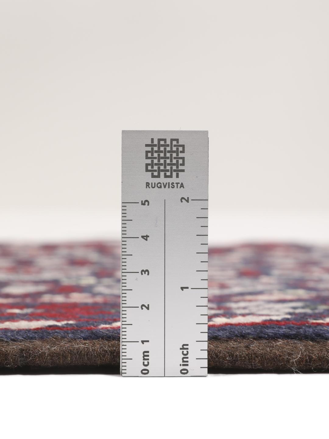 Handmade Baluch rug from the Middle East in dark-blue and dark-red tones.