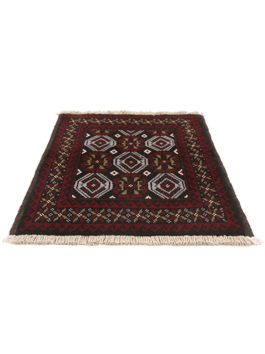 A small, hand-knotted Beluch rug from the Middle East featuring geometric patterns in dark red and black.