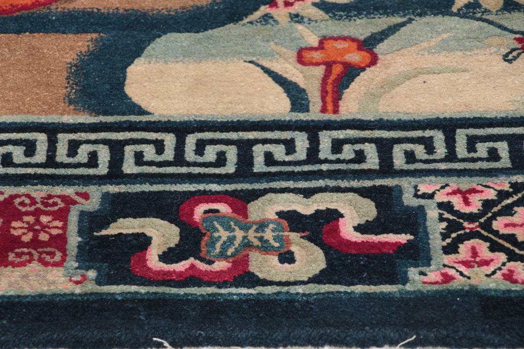 Antique Chinese Art Deco rug featuring a phoenix motif in dark-blue and pink