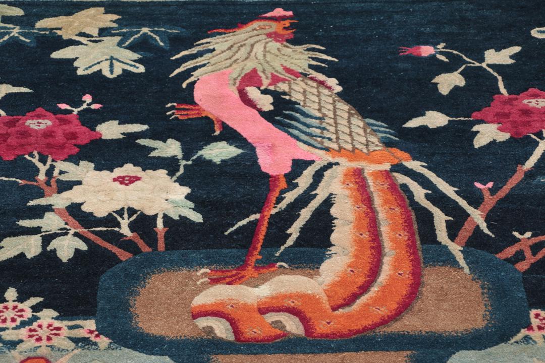Antique Chinese Art Deco rug featuring a phoenix motif in dark-blue and pink