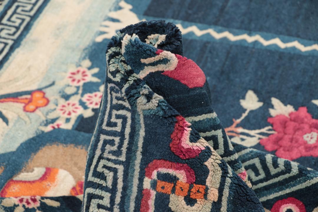 Antique Chinese Art Deco rug featuring a phoenix motif in dark-blue and pink