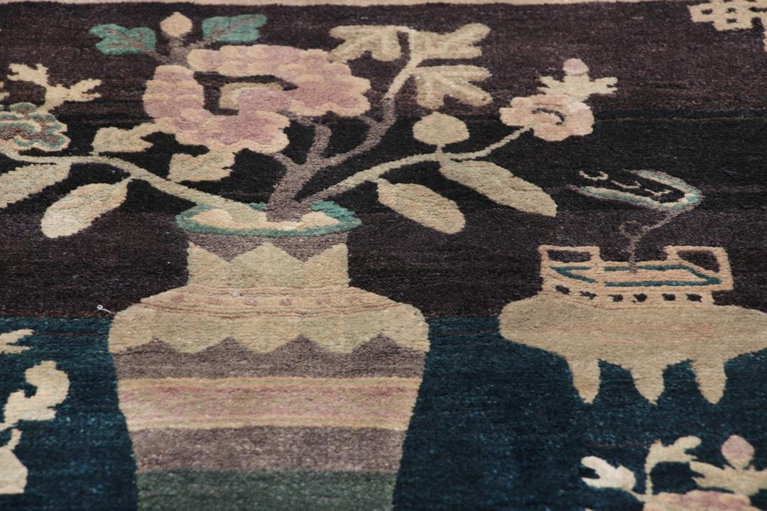 Antique Chinese hand-knotted rug in deep blue and black with floral motifs