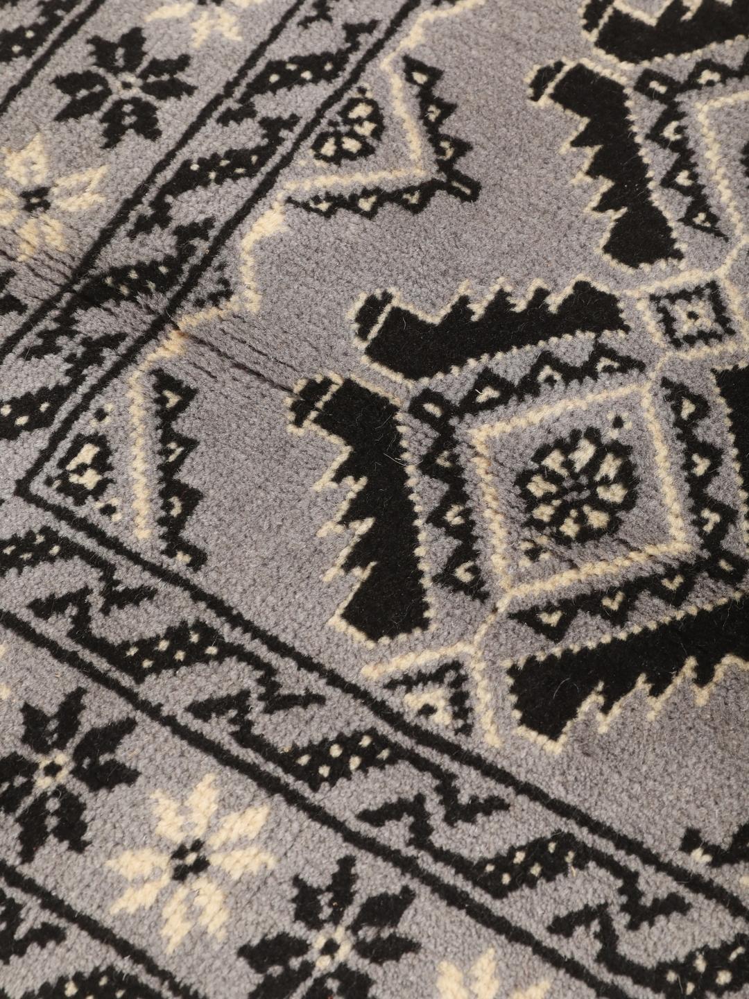 Hand-knotted Middle Eastern Baluch rug in grey and black with geometric patterns