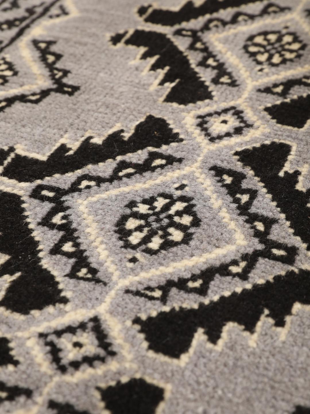 Hand-knotted Middle Eastern Baluch rug in grey and black with geometric patterns