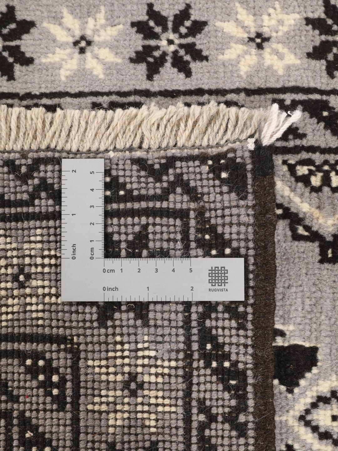 Hand-knotted Middle Eastern Baluch rug in grey and black with geometric patterns