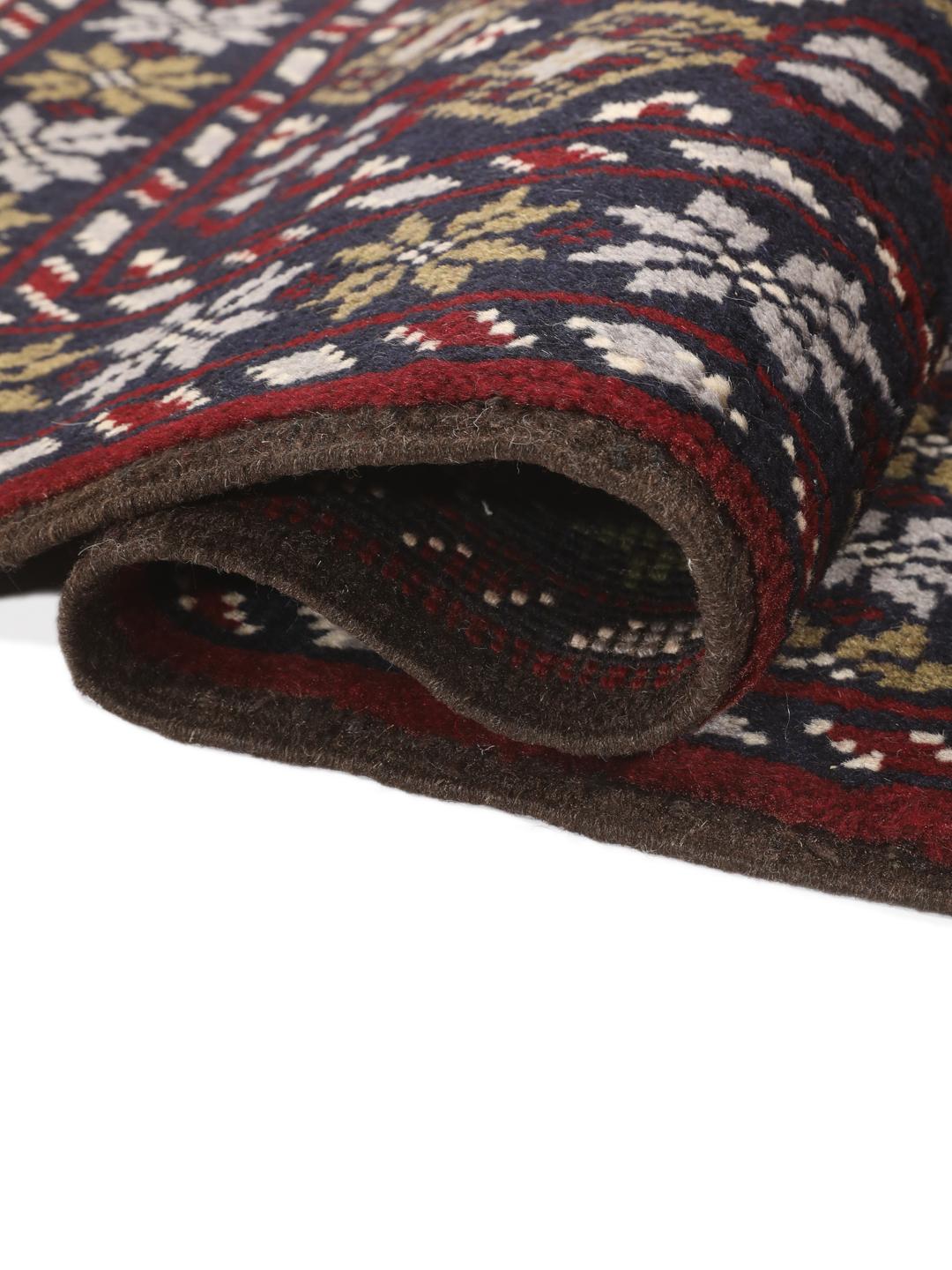 Hand-knotted Beluch rug with tribal motifs in dark-blue and red tones