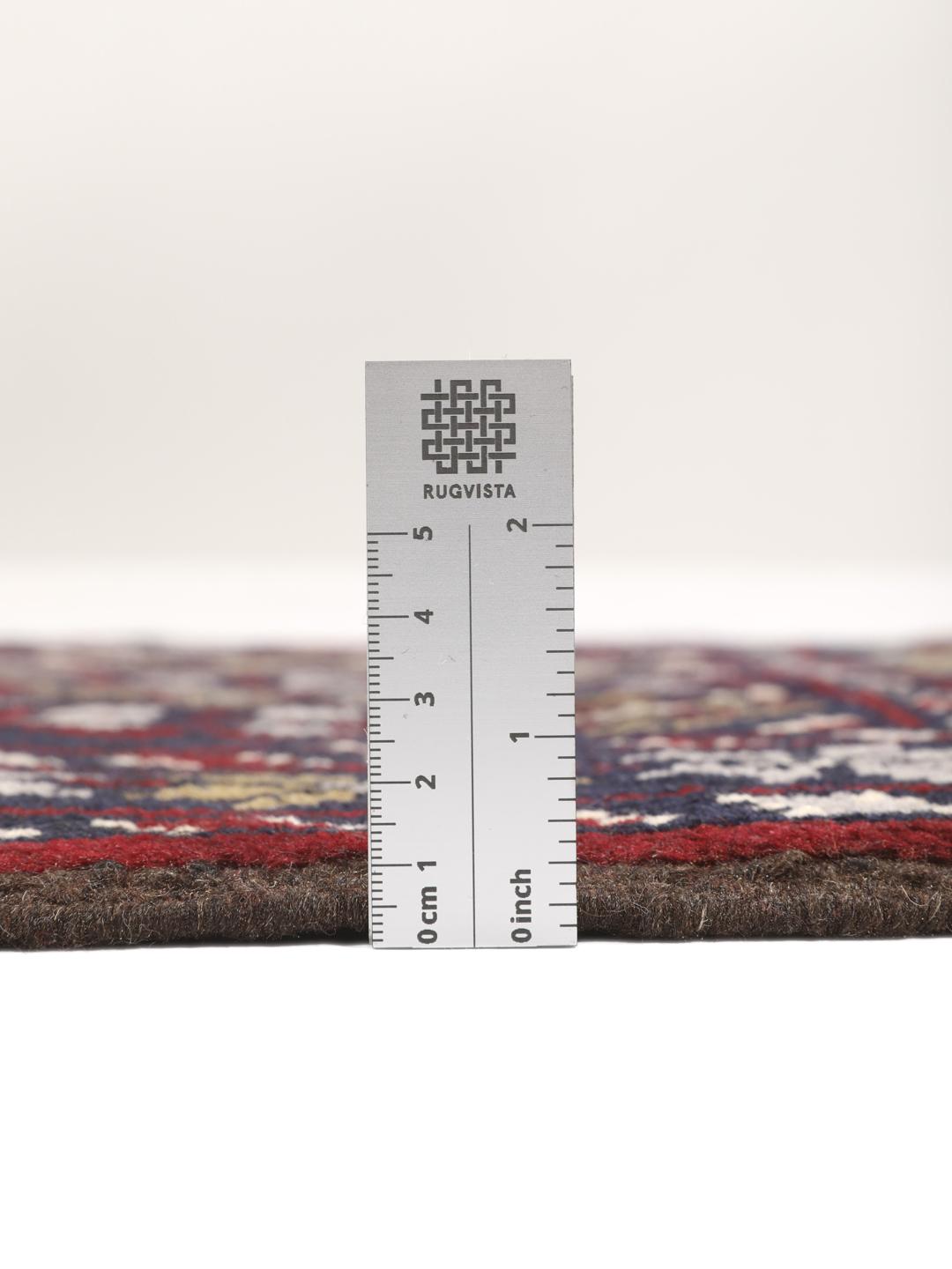Hand-knotted Beluch rug with tribal motifs in dark-blue and red tones