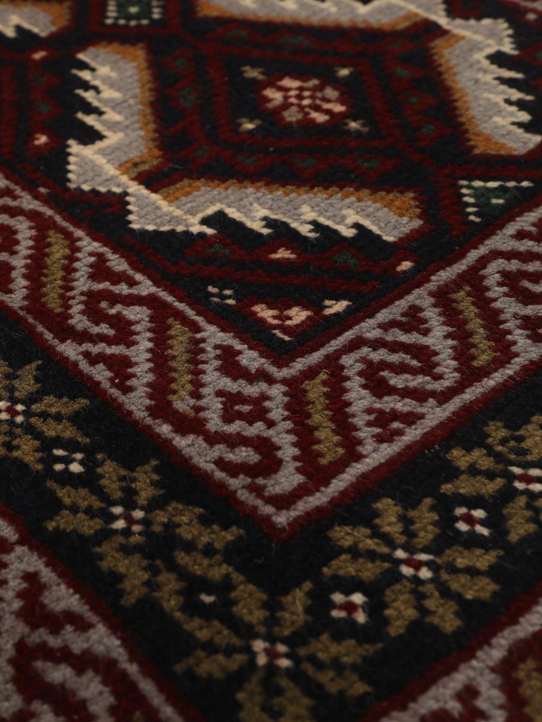 Hand-knotted Middle Eastern Baluch rug in dark-red and dark-blue Wool
