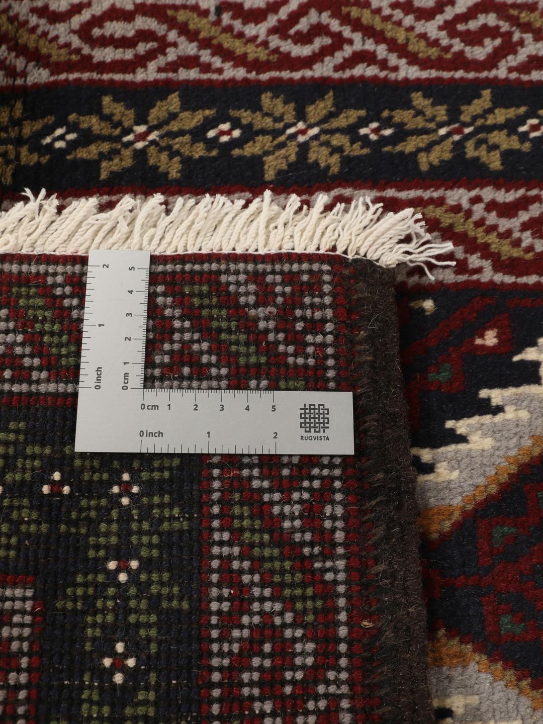 Hand-knotted Middle Eastern Baluch rug in dark-red and dark-blue Wool