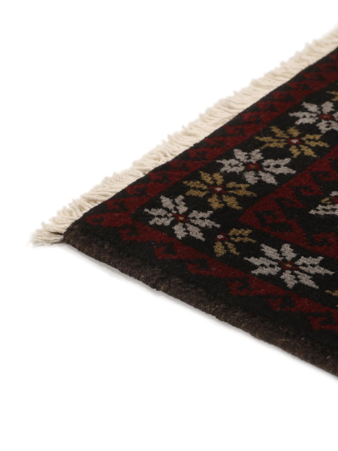 Handmade Middle Eastern Beluch rug with tribal motifs in multicolor
