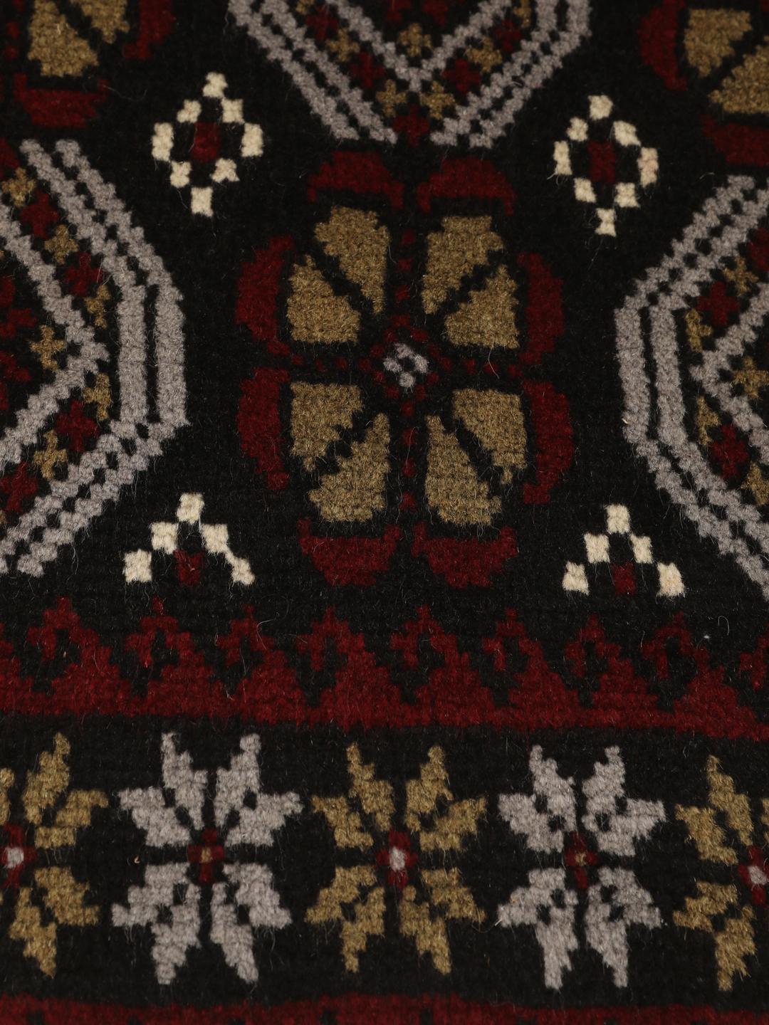 Handmade Middle Eastern Beluch rug with tribal motifs in multicolor