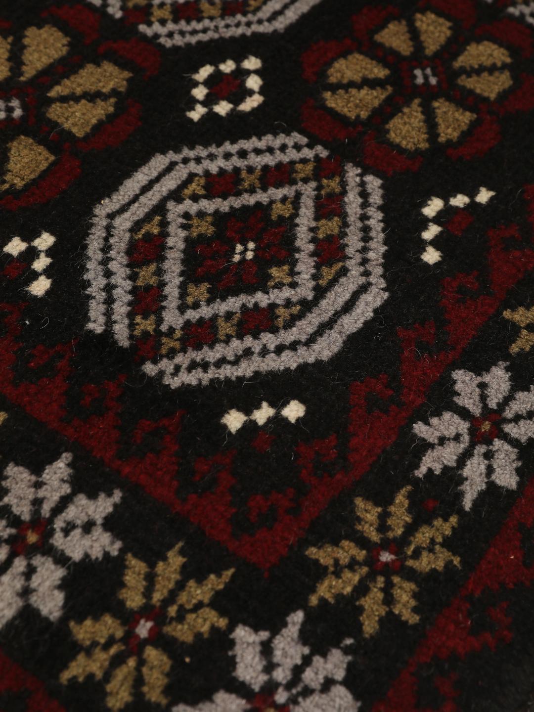 Handmade Middle Eastern Beluch rug with tribal motifs in multicolor