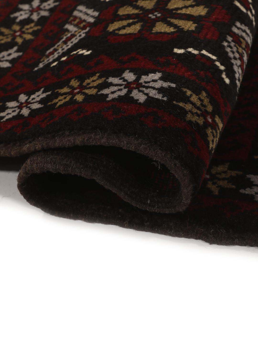 Handmade Middle Eastern Beluch rug with tribal motifs in multicolor