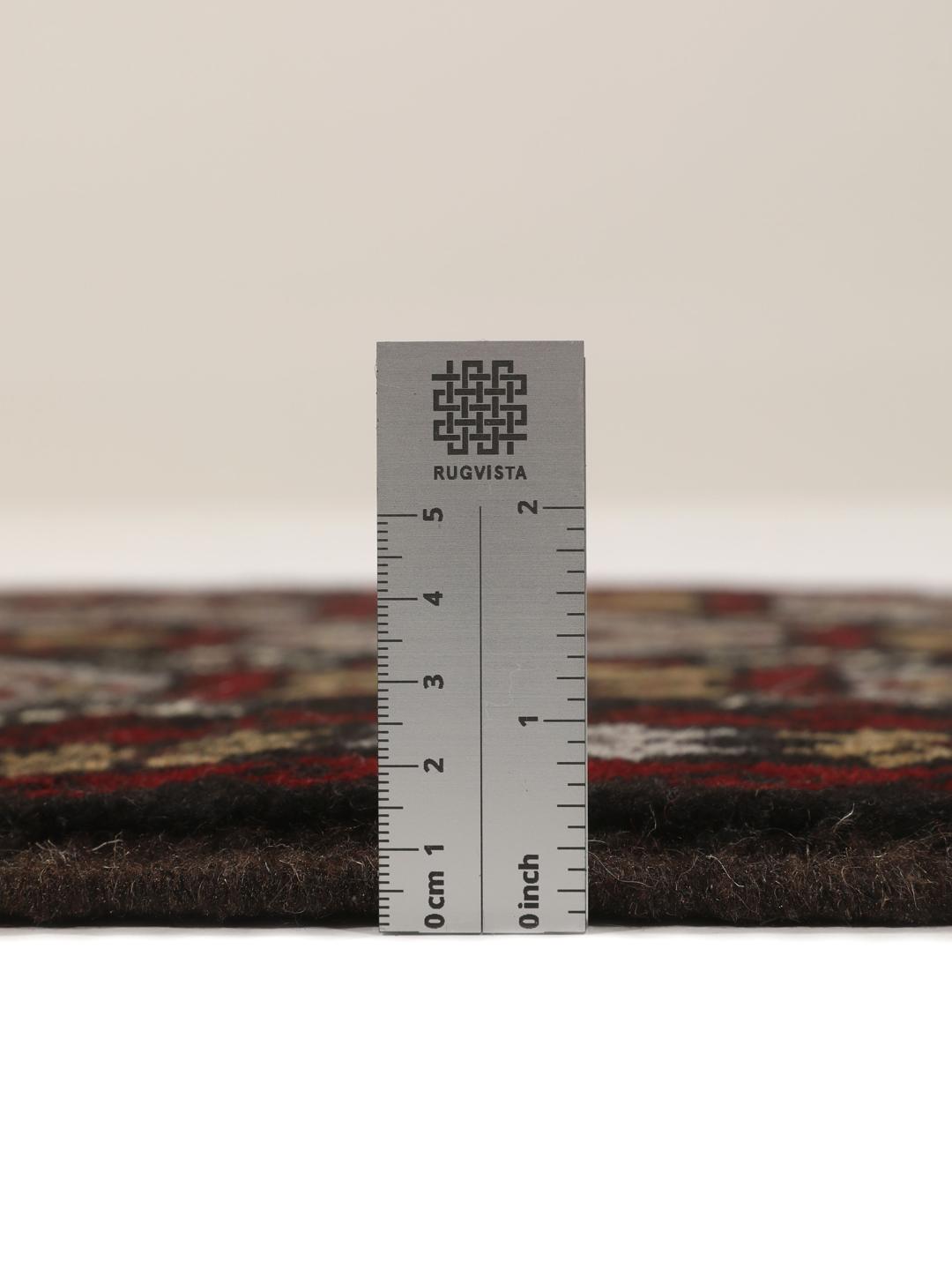 Handmade Middle Eastern Beluch rug with tribal motifs in multicolor