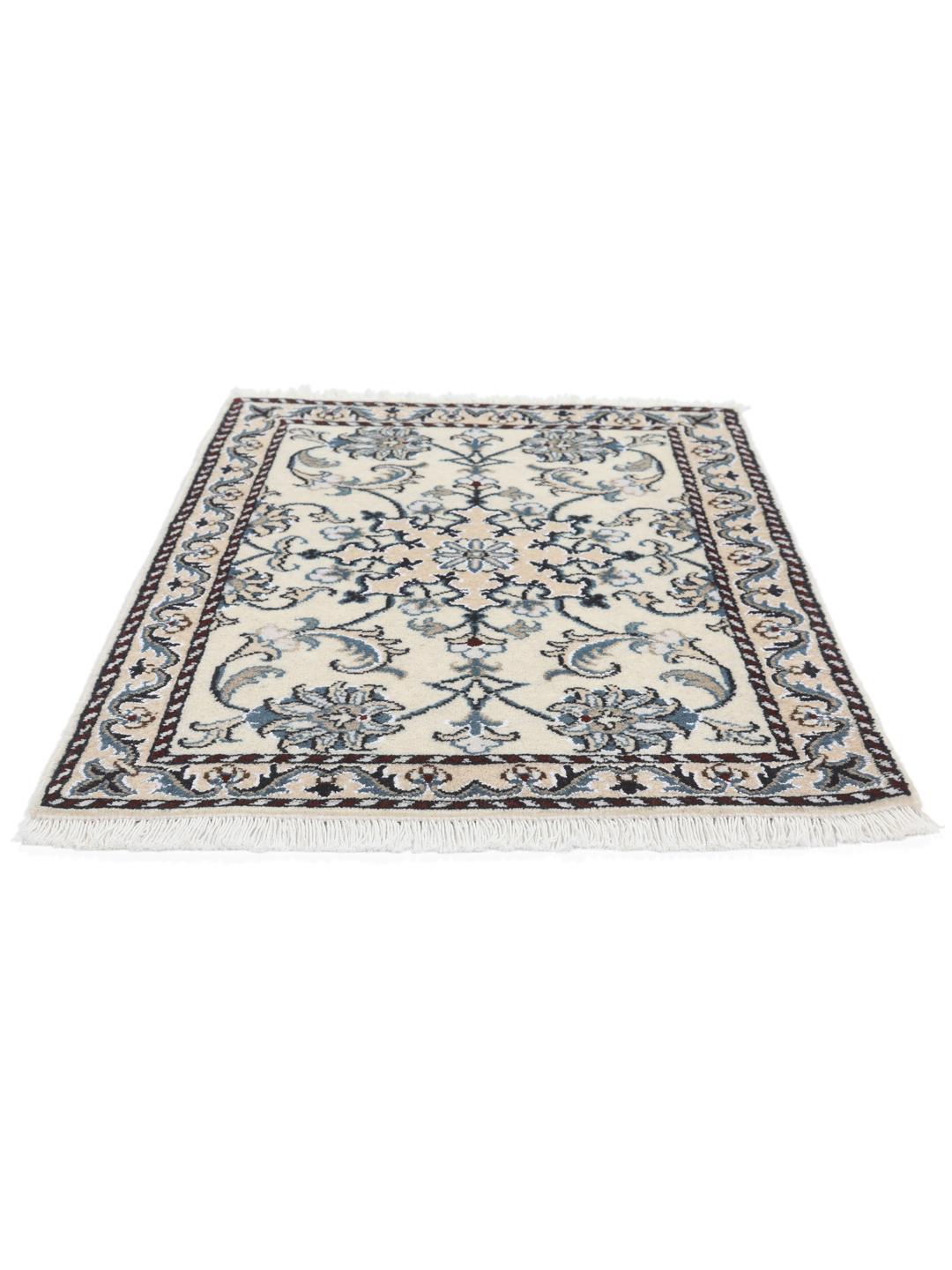 A hand-knotted floral Nain rug from the Middle East in beige and blue tones.