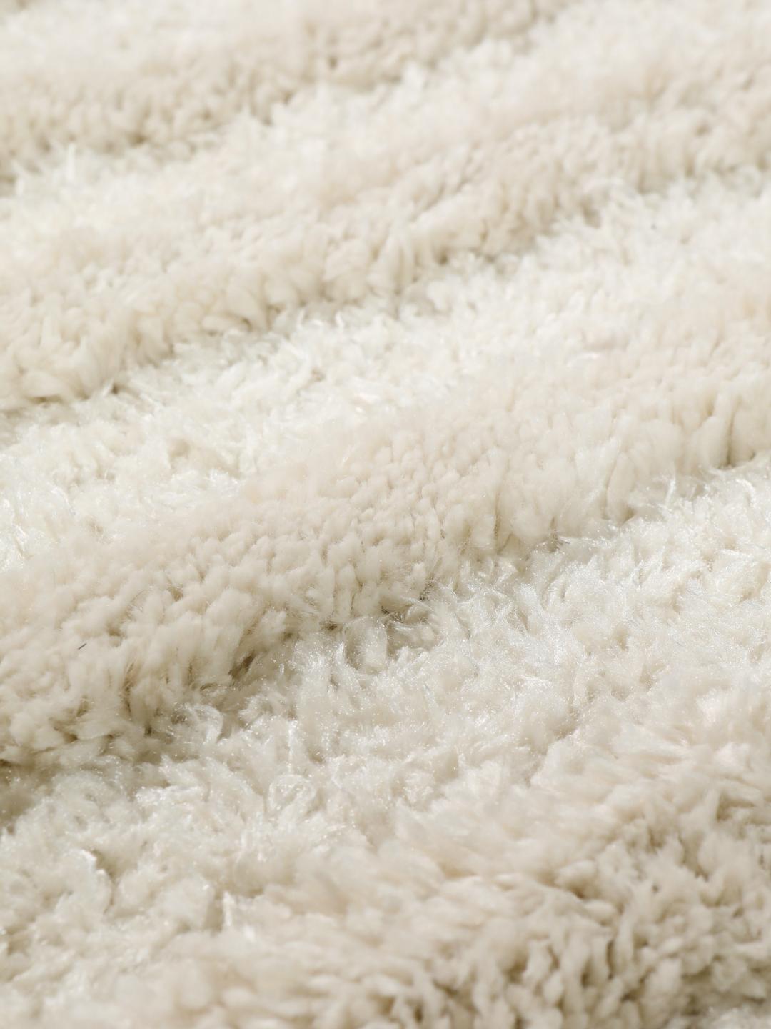 Offwhite tapijt met hoge en lage pooltextuur