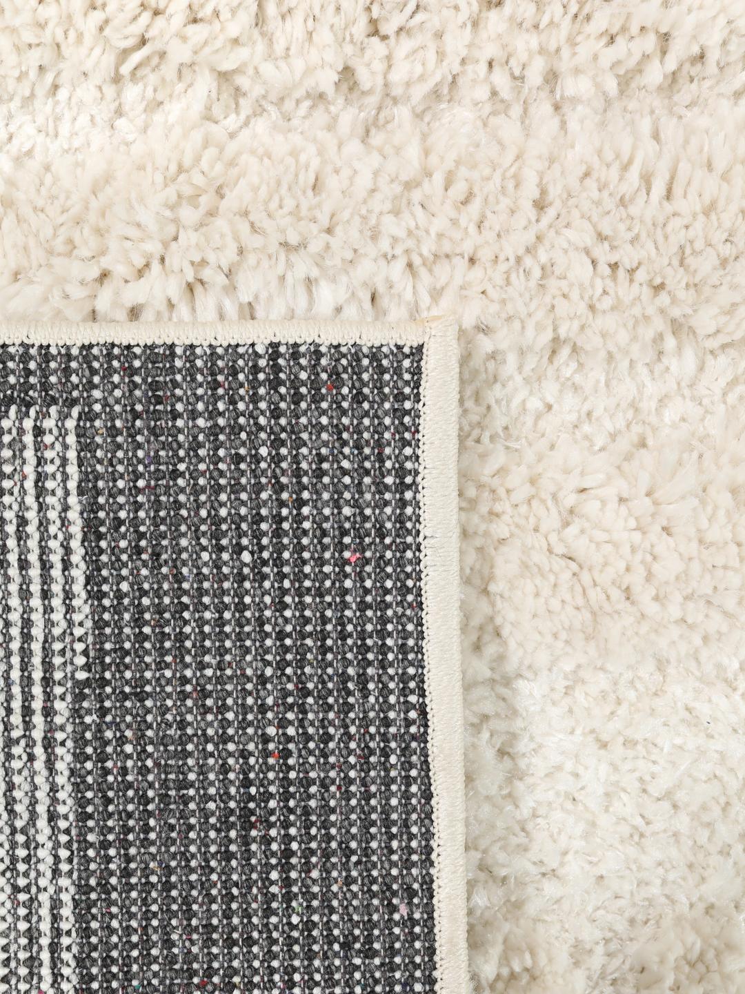 Offwhite tapijt met hoge en lage pooltextuur