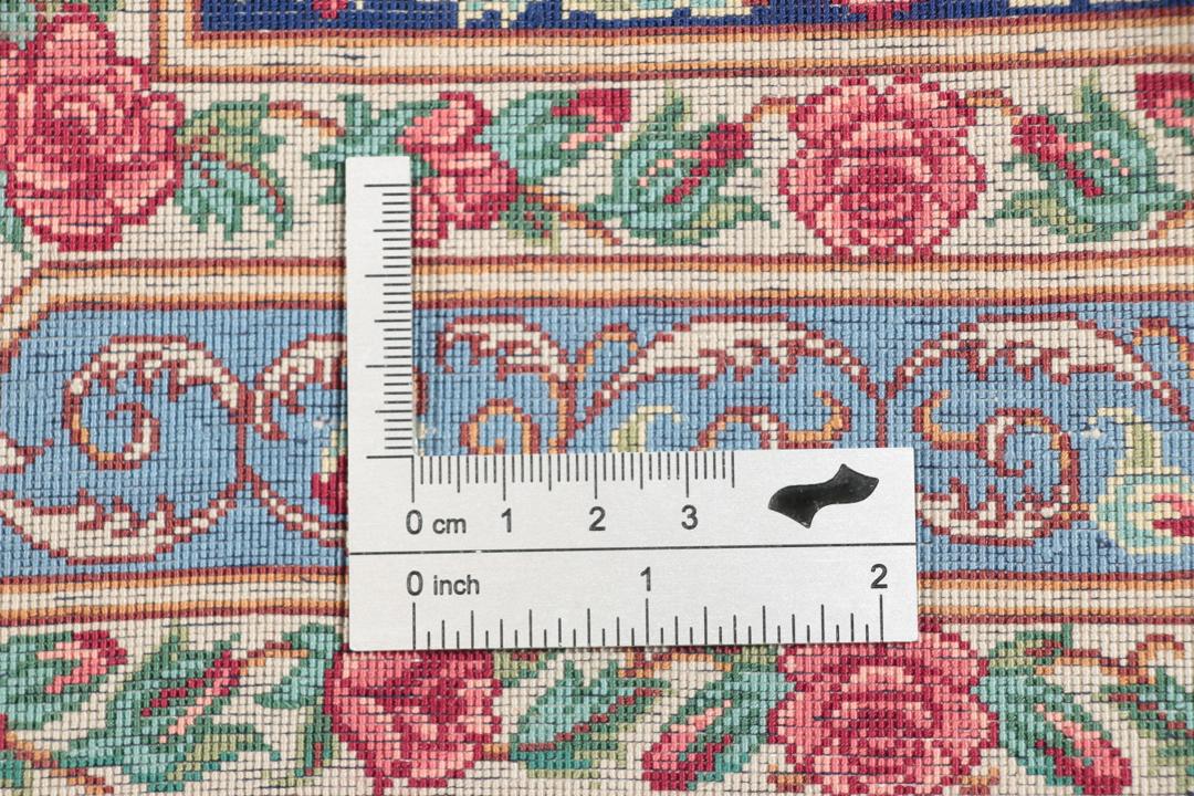 Håndknyttet mellemøstligt silketeppe i mørkeblåt og rødt med traditionelle blomstermotiver
