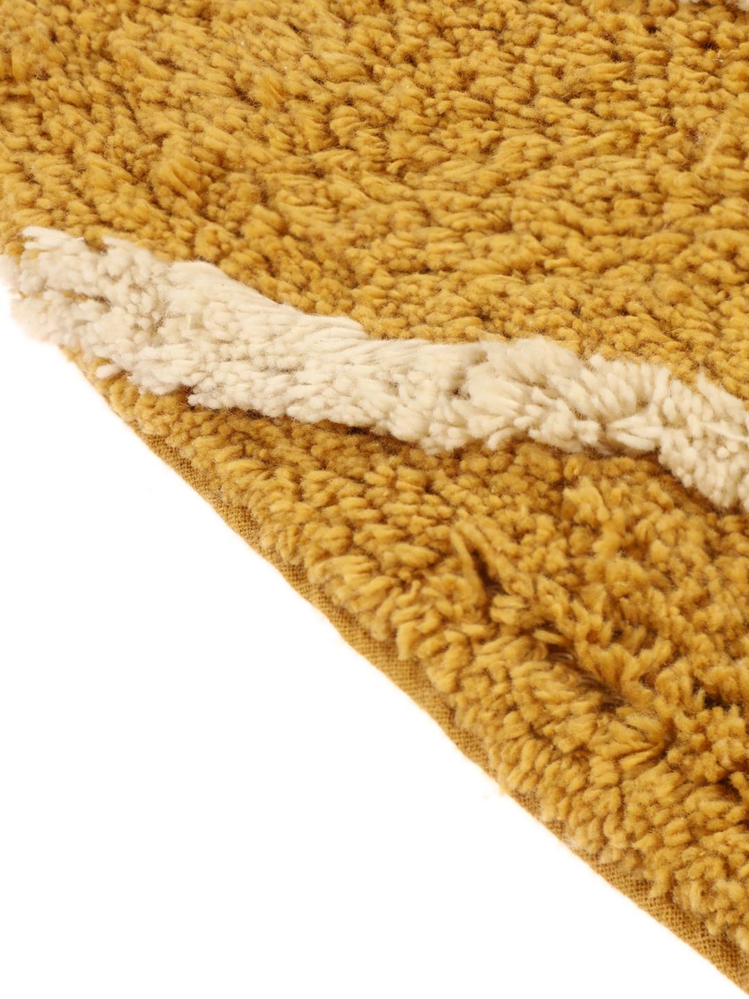 Tapis de bain rond à motif jaune et blanc
