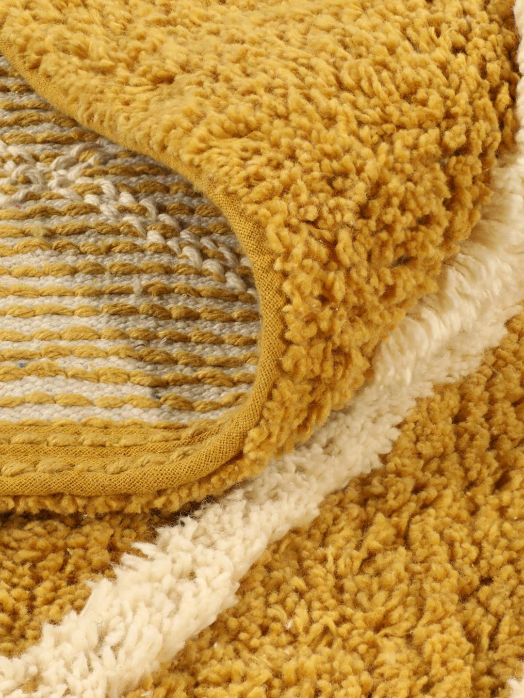 Tapis de bain rond à motif jaune et blanc