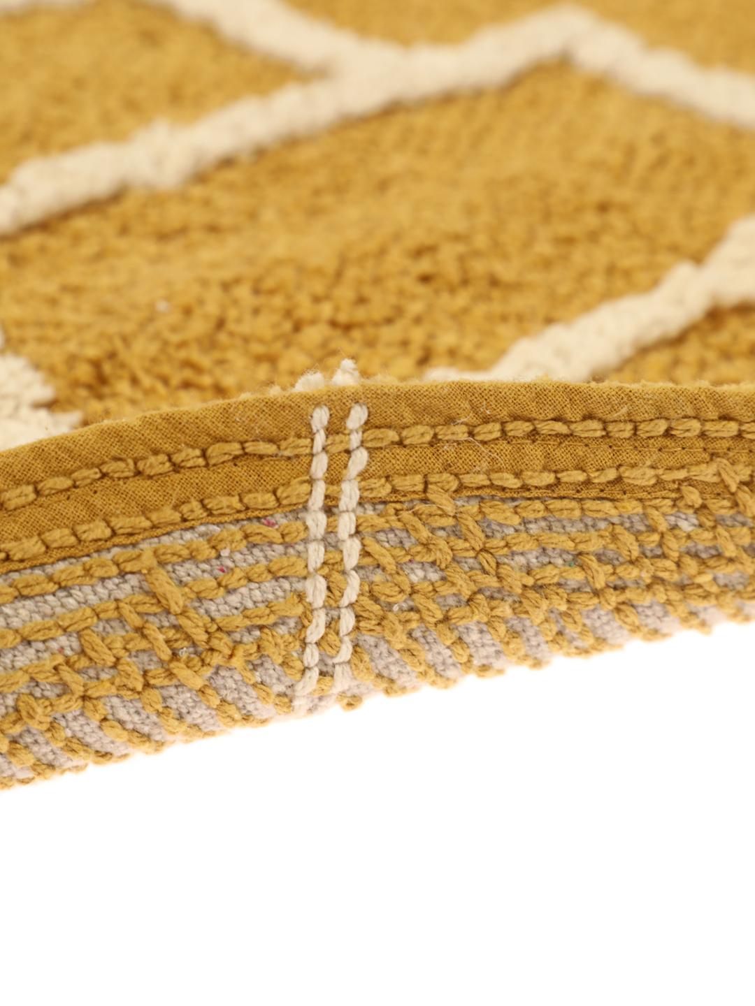 Tapis de bain rond à motif jaune et blanc
