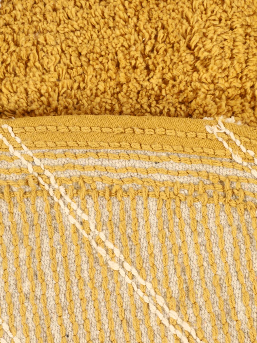 Tapis de bain rond à motif jaune et blanc