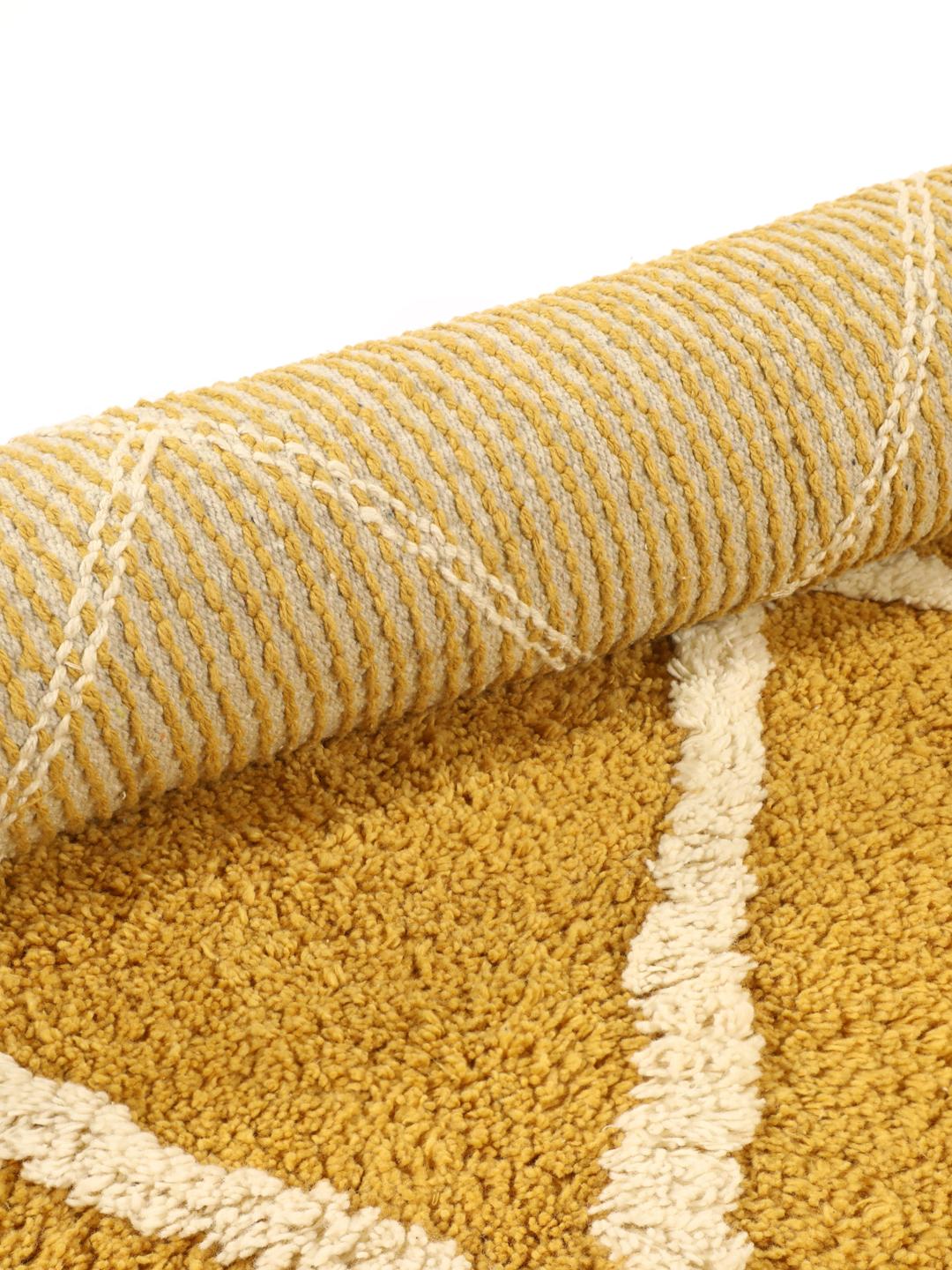 Tapis de bain rond à motif jaune et blanc