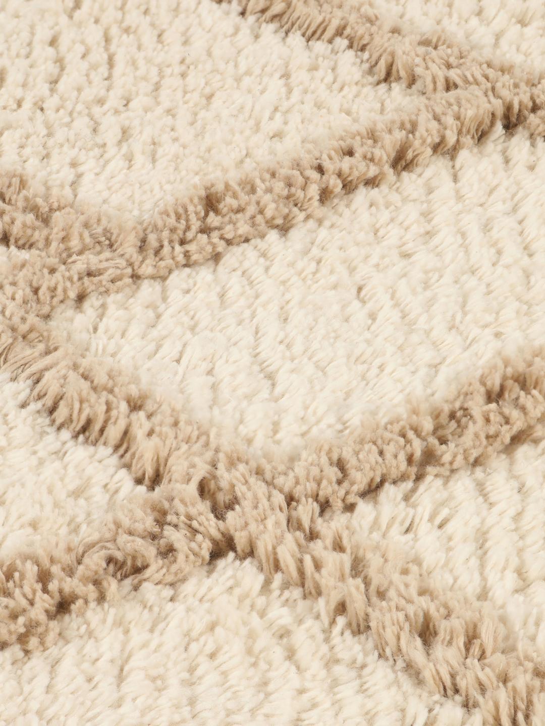 Tapis de bain rond beige et blanc à motif géométrique