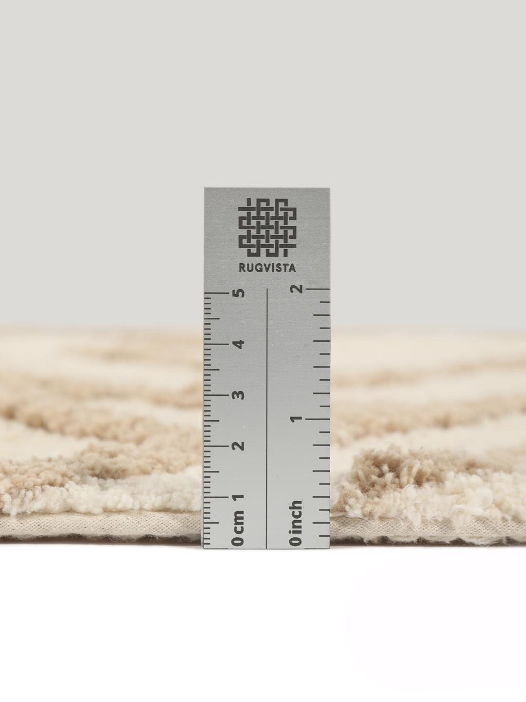 Tapis de bain rond beige et blanc à motif géométrique