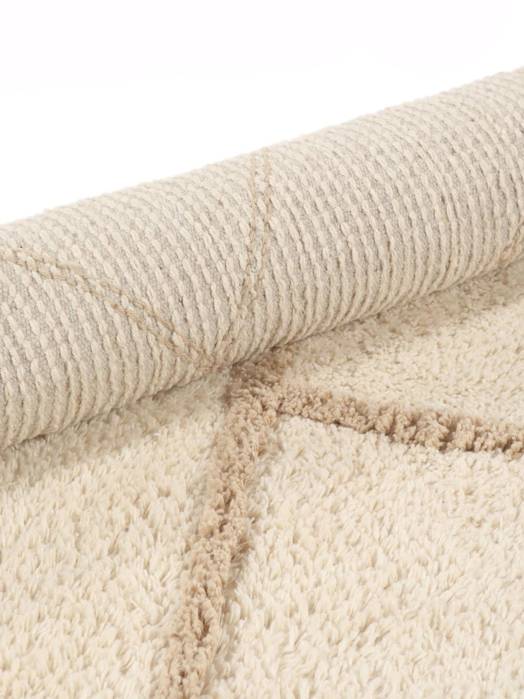 Tapis de bain rond beige et blanc à motif géométrique