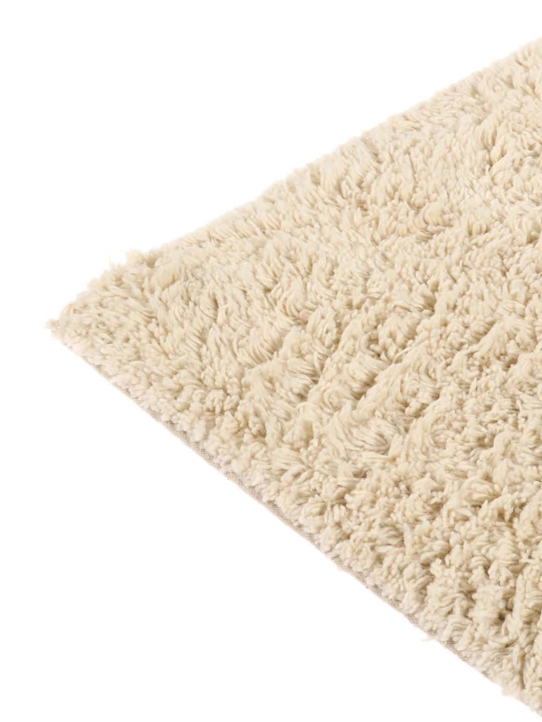 Tapis de bain en coton blanc et noir avec un motif d'arêtes de poisson