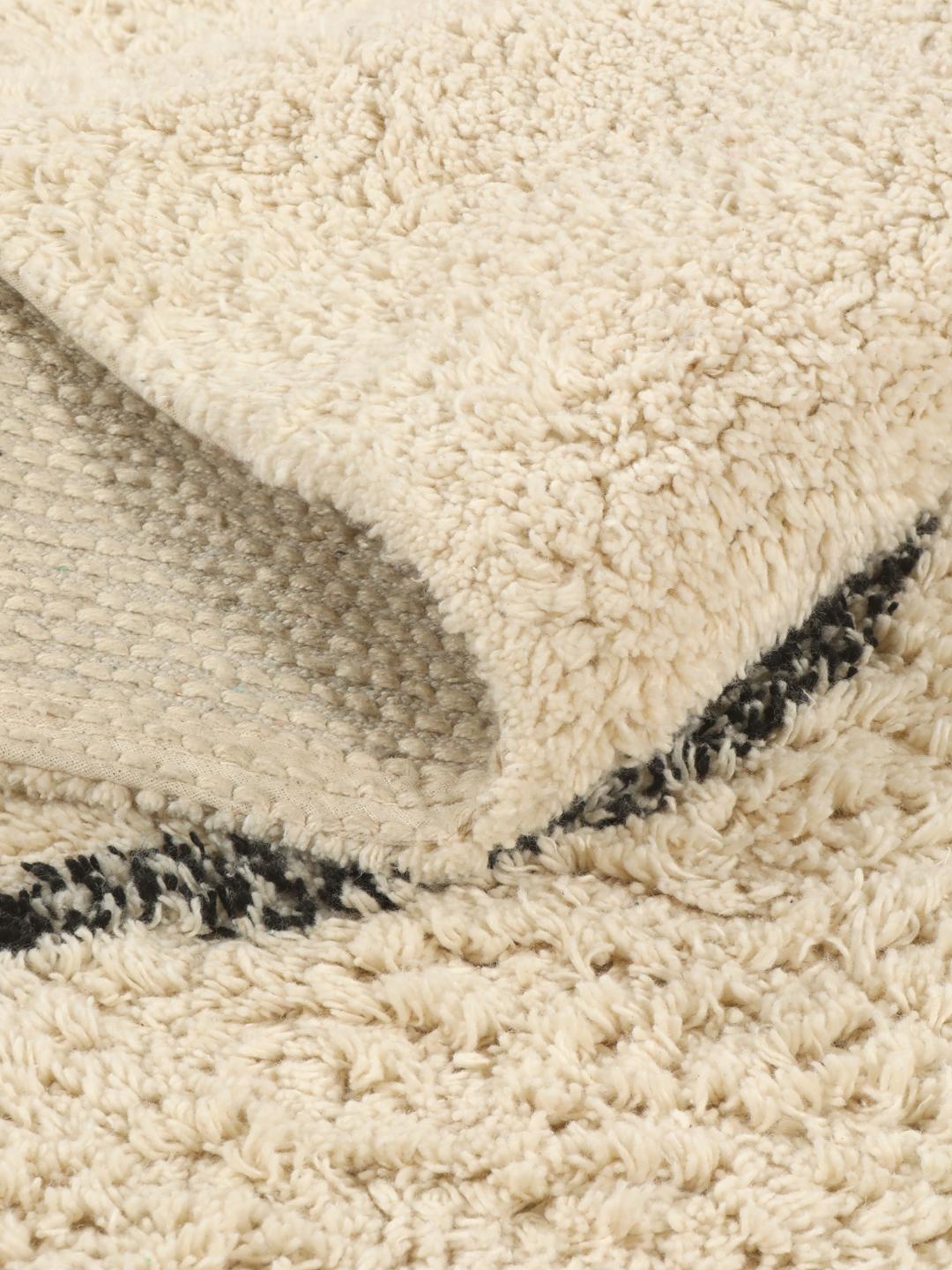 Tapis de bain en coton blanc et noir avec un motif d'arêtes de poisson